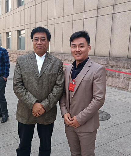 袁国力中国书法家协会理事、隶书委员会副主任张继合影.jpg