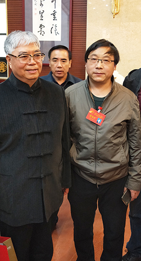 道金平老师与中国书法家协会副主席张飚合影.jpg