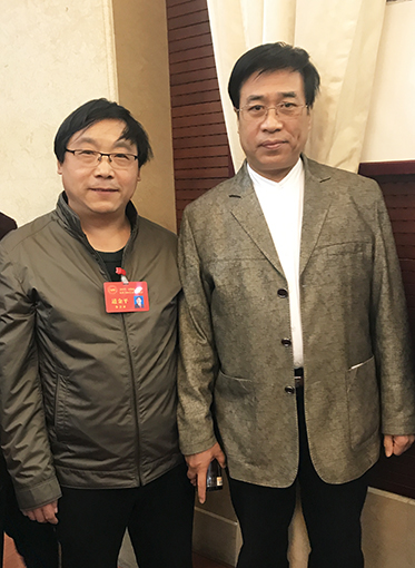 道金平老师与中国书协理事张继合影.jpg